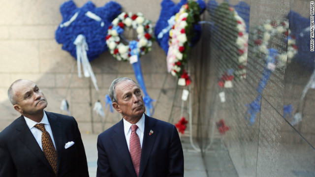 Bloomberg and New York Police Commissioner Ray Kelly look at the New York Memorial Wall during an unveiling in October 2012. The city added the names of 15 officers who died the previous year.