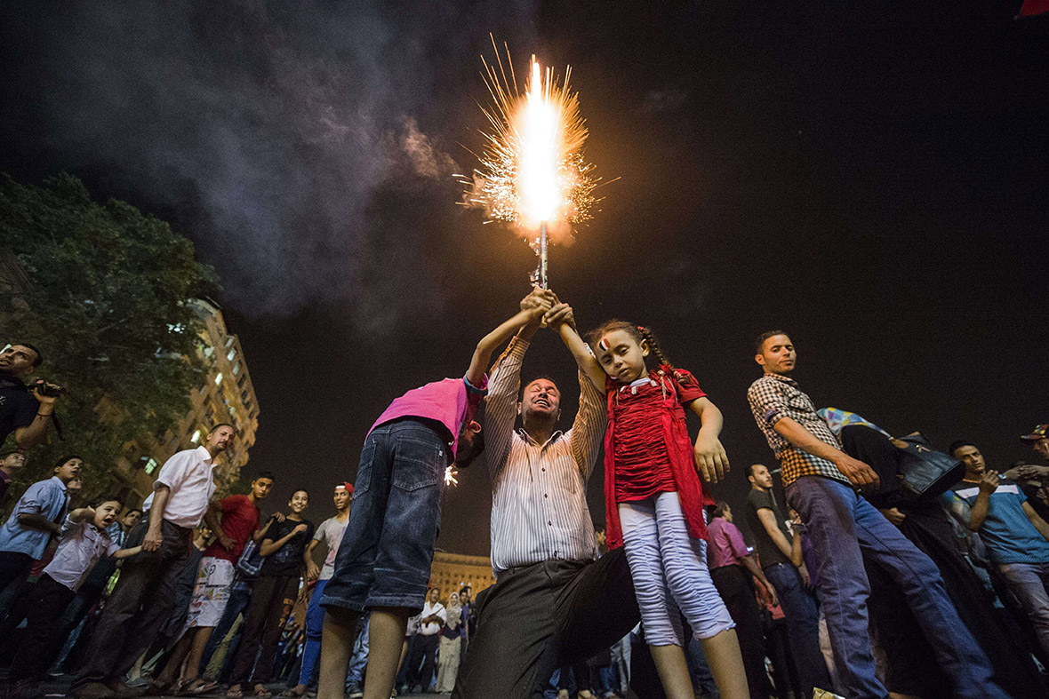 Egyptians celebrate in Cairo's Tahrir Square after ex-army chief Abdel Fattah al-Sisi won 96.9 percent of the vote in Egypt's presidential election