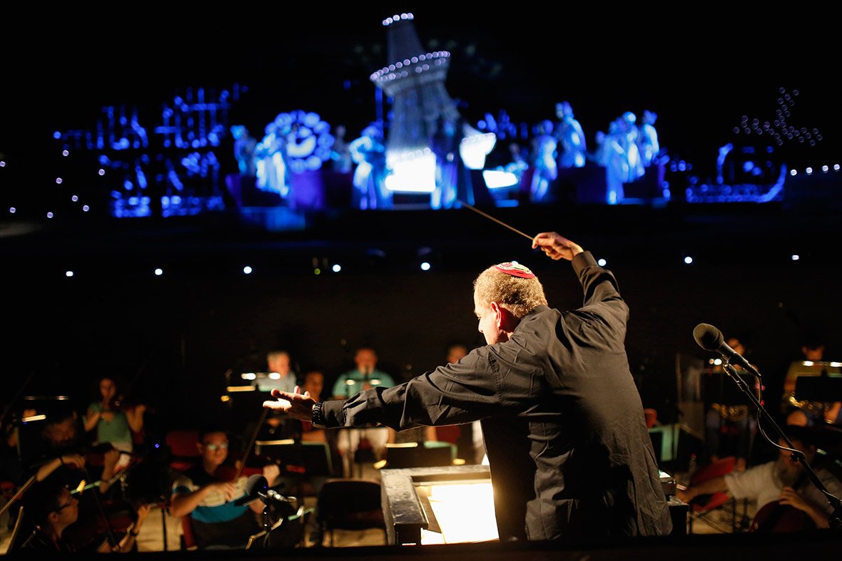 Conductor Daniel Oren directs the orchestra during a dress rehearsal of La Traviata