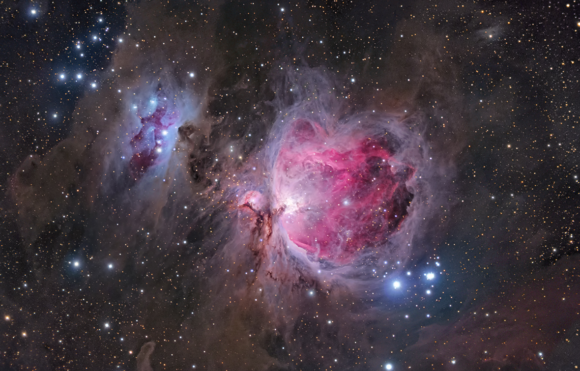 Orion Nebula by Anna Morris (USA). In this view of M42, more commonly known as the Orion Nebula, the photographer has emphasised the delicate veils of dust surrounding the more familiar gleaming heart of the nebula. The image highlights the structure of the object, giving a sense of vast cavities filled with pink hydrogen gas and the blue haze of reflected starlight.