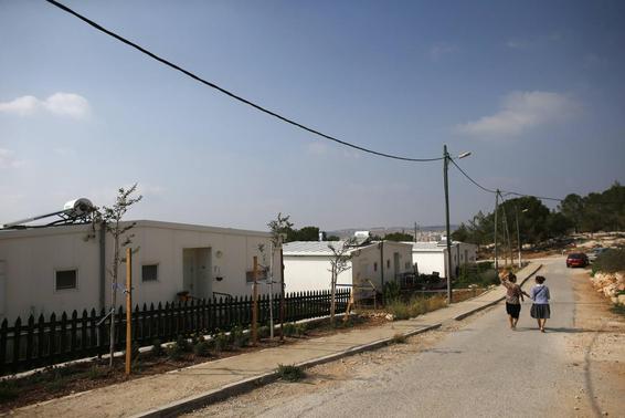 Israeli women walk in a Jewish settlement known as 'Gevaot', in the Etzion settlement bloc, near Bethlehem August 31, 2014. Israel announced on Sunday a land appropriation in the occupied West Bank that an anti-settlement group termed the biggest in 30 years and a Palestinian official said would cause only more friction after the Gaza war. Some 400 hectares (988 acres) in the Etzion settlement bloc near Bethlehem were declared 'state land, on the instructions of the political echelon' by the military-run Civil Administration. Construction of a major settlement at the location has been mooted by Israel since 2000. Last year, the government invited bids for the building of 1,000 housing units at the site. REUTERS/Ronen Zvulun (WEST BANK - Tags: POLITICS SOCIETY)