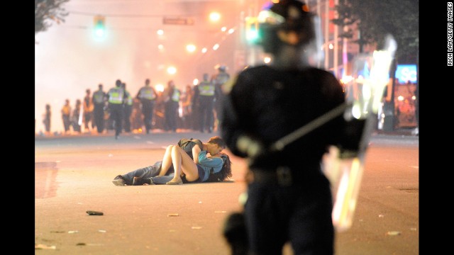 A couple kisses during a riot in Vancouver, British Columbia, after the hometown NHL hockey team lost the Stanley Cup Final in June 2011. Getty Images, an online photo archive with more than 35 million images, is now allowing "noncommercial" users to use this and other photos for free on their websites or social media. Click through to see some of the other iconic images now available. 