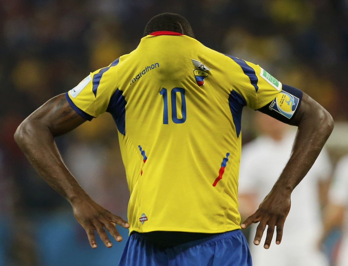Ecuador's Walter Ayovi covers his face with his jersey after their 2014 World Cup Group E soccer match against France