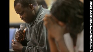 MANCHESTER, NH - MAY 25: Pastor Monyroor Teng leads a prayer at the Sudanese Evangelical Covenant Church. (Photo by Lane Turner/The Boston Globe/Getty Images)
