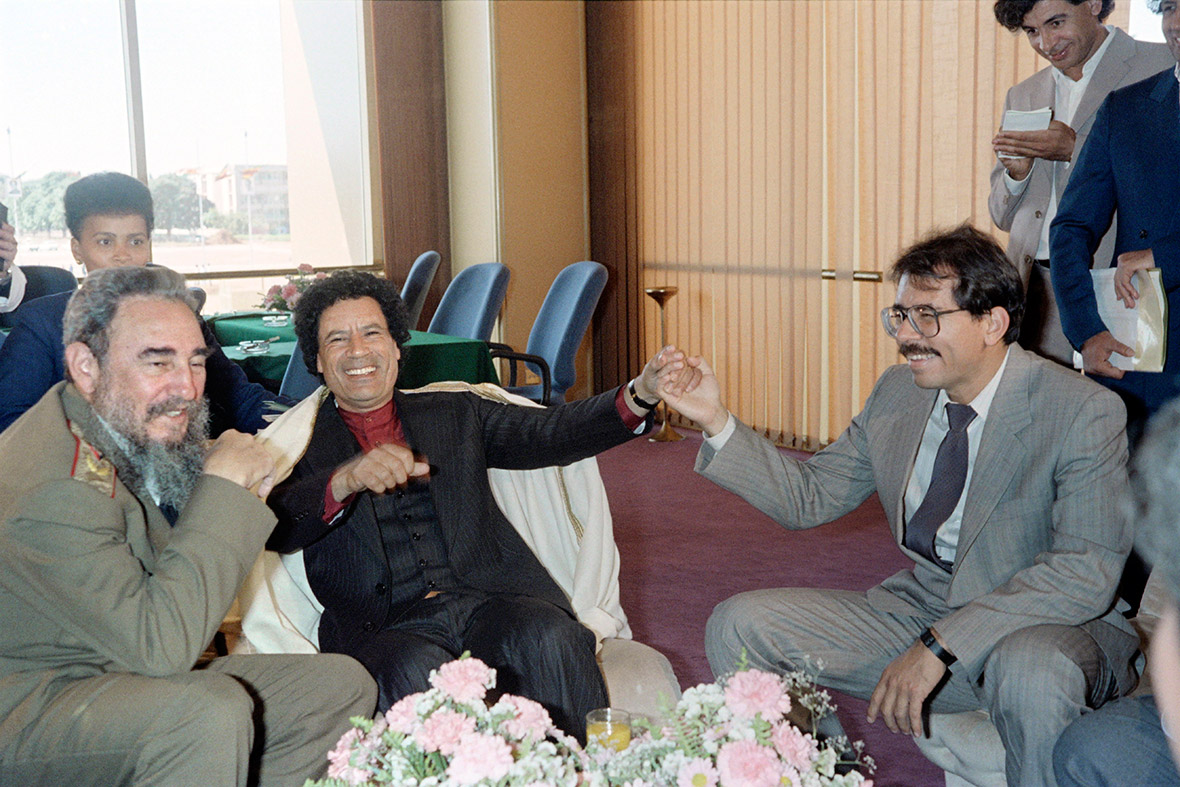 4 September 1986: Castro jokes with his counterparts Libyan leader Muammar Gaddafi and Nicaraguan president Daniel Ortega during the non-aligned countries summit, in Harare, Zimbabwe.