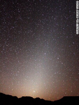 The light extending upwards from the horizon is zodiacal light, says Dr. George Tucker, a former professor of physics and astronomy. The Beehive cluster is in the center of the light by the Namibian horizon with the constellation of Cancer around it and the stars of Leo above. 