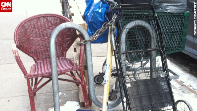 A shopping cart is chained to a bike rack with all its paraphernalia in New York City. "I assumed it belonged to a homeless person who locks it up whenever he or she takes shelter from the cold," <a href='http://ift.tt/NukIFU'>Marjorie Zien</a> said. "Based on the appearance, it is definitely 'owned' by someone."