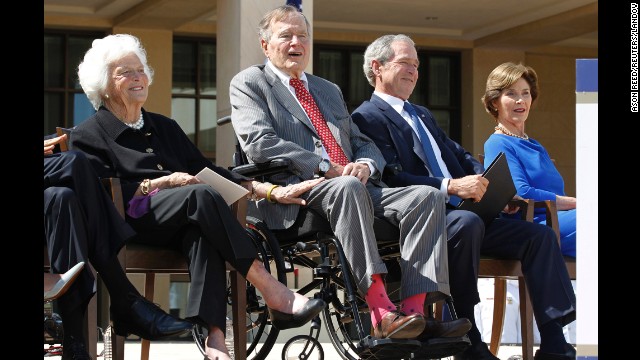 Bush wears socks featuring the American flag at the dedication ceremony for his son's presidential library in Dallas, Texas, in April 2013.