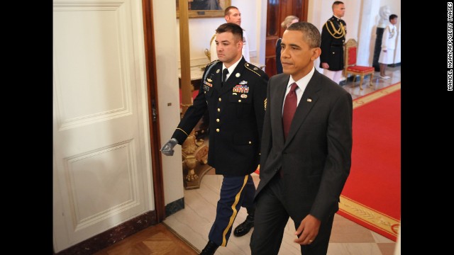 President Obama walks with Army Sgt. 1st Class Leroy Arthur Petry, who received the Medal of Honor on July 12, 2011. Petry was cited for his actions during a battle in Paktya province, Afghanistan, on May 26, 2008, which included picking up an enemy grenade thrown at him and fellow soldiers. As he was about to throw it away, the grenade exploded and blew off his right hand, according to his citation.
