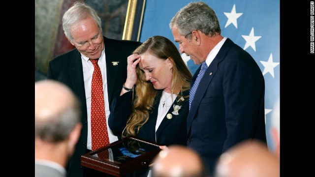 President George W. Bush presents the Medal of Honor to Daniel and Maureen Murphy, parents of Navy Lt. Michael Murphy, on October 22, 2007. Murphy, a Navy SEAL, was killed June 28, 2005, when his four-man team was assaulted by 30 to 40 enemy fighters. Murphy exposed himself to repeated enemy fire while trying to radio for help for his besieged team, his citation said.