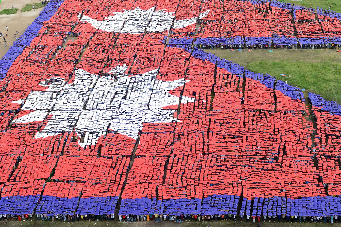 An aerial view of the Nepalese national flag formed by over 35,000 people in Kathmandu in a bid to break the world record, which was set in February 2014 when 28,957 people created the Pakistan flag in Lahore