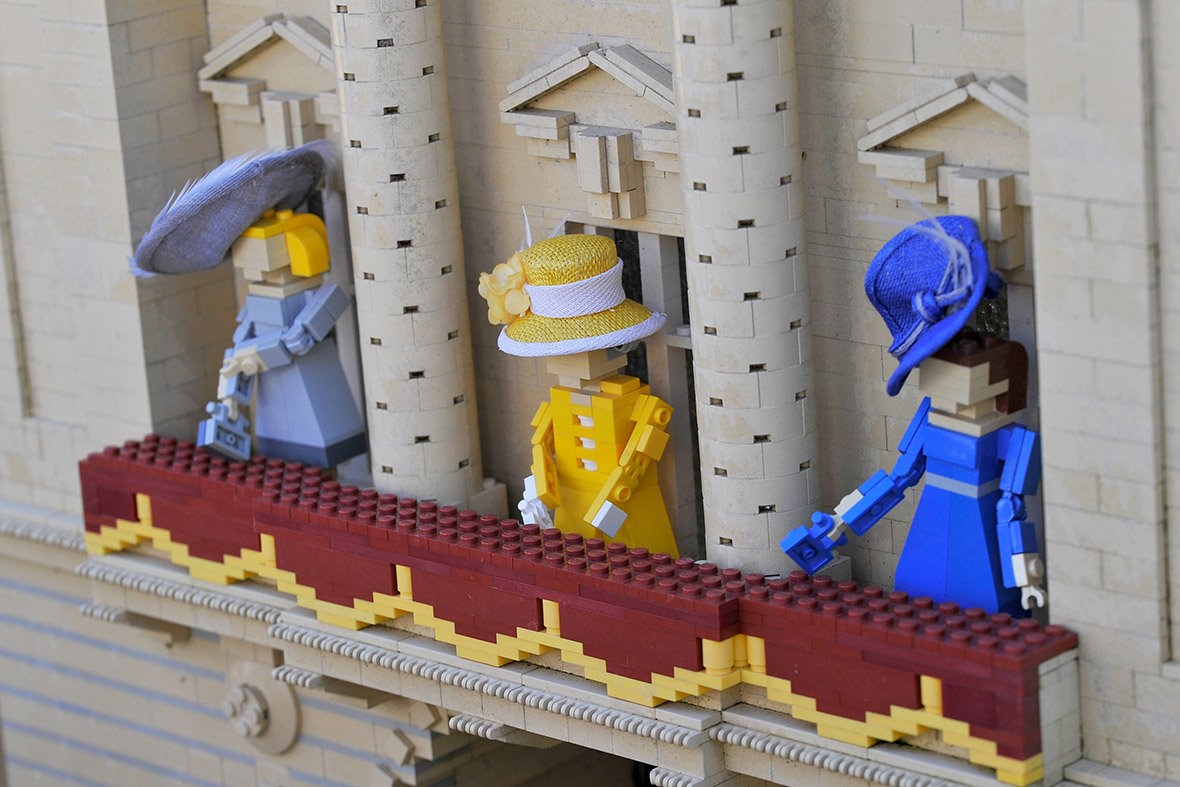 Lego figures of Camilla, the Queen and Kate Middleton stand on the Buckingham Palace balcony at Legoland wearing designer hats by Rachel Trevor-Morgan.