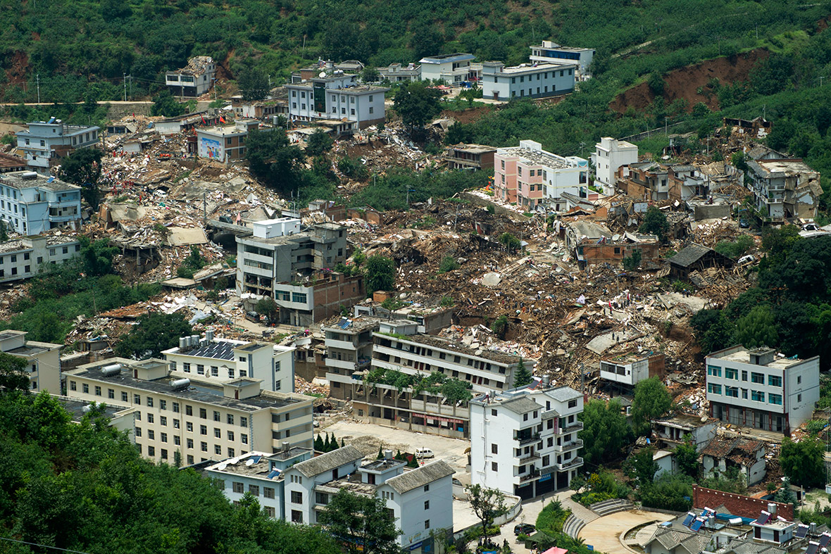 Collapsed buildings are seen after a magnitude 6.3 earthquake hit Longtoushan town, Ludian county, Zhaotong, Yunnan province, China