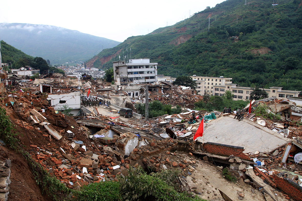 Rescuers search for survivors among collapsed buildings after an earthquake hit Ludian county