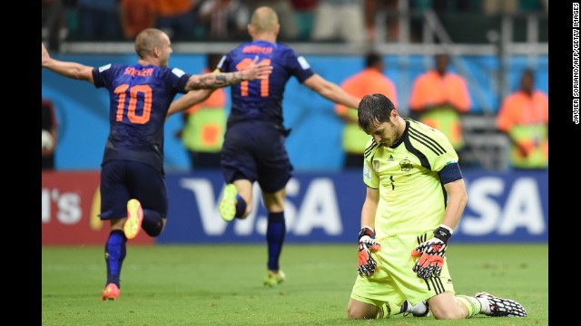 Spanish goalkeeper Iker Casillas, right, reacts after Dutch forward Arjen Robben, center, scored to put the finishing touches on a 5-1 win for the Netherlands on June 13. It was Robben's second goal of the match.