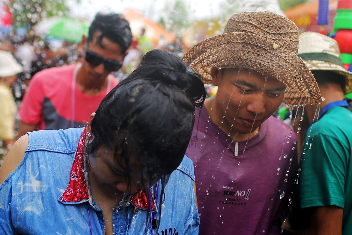 Tourists and Thai residents take part in a water fight in Chiang Mai