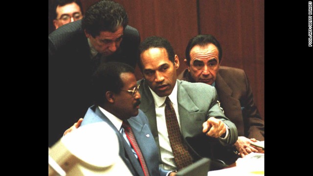 Probably one of the most famous cases ever involving a celebrity, O.J. Simpson, center, was arrested for the murders of his ex-wife, Nicole Brown Simpson, and her friend, Ron Goldman, in 1994. Here he confers with attorneys Johnnie Cochran, left, and Robert Shapiro, right, during a hearing in 1995. Simpson's friend Robert Kardashian stands behind him. Simpson, a former professional football player, was acquitted in the criminal case.