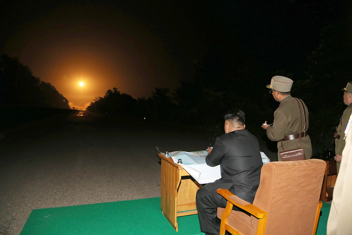 North Korean leader Kim Jong-un provides field guidance during a tactical rocket firing drill carried out by units of the Korean People's Army Strategic Force