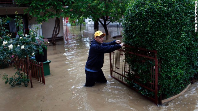 A man walks outside his home after severe floods in Obrenovac, Serbia, on May 16.