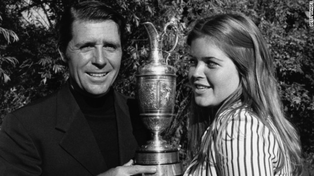 Gary Player holds the 1974 British Open trophy aloft with his then 15-year-old daughter Jennifer after his victory at Royal Lytham.