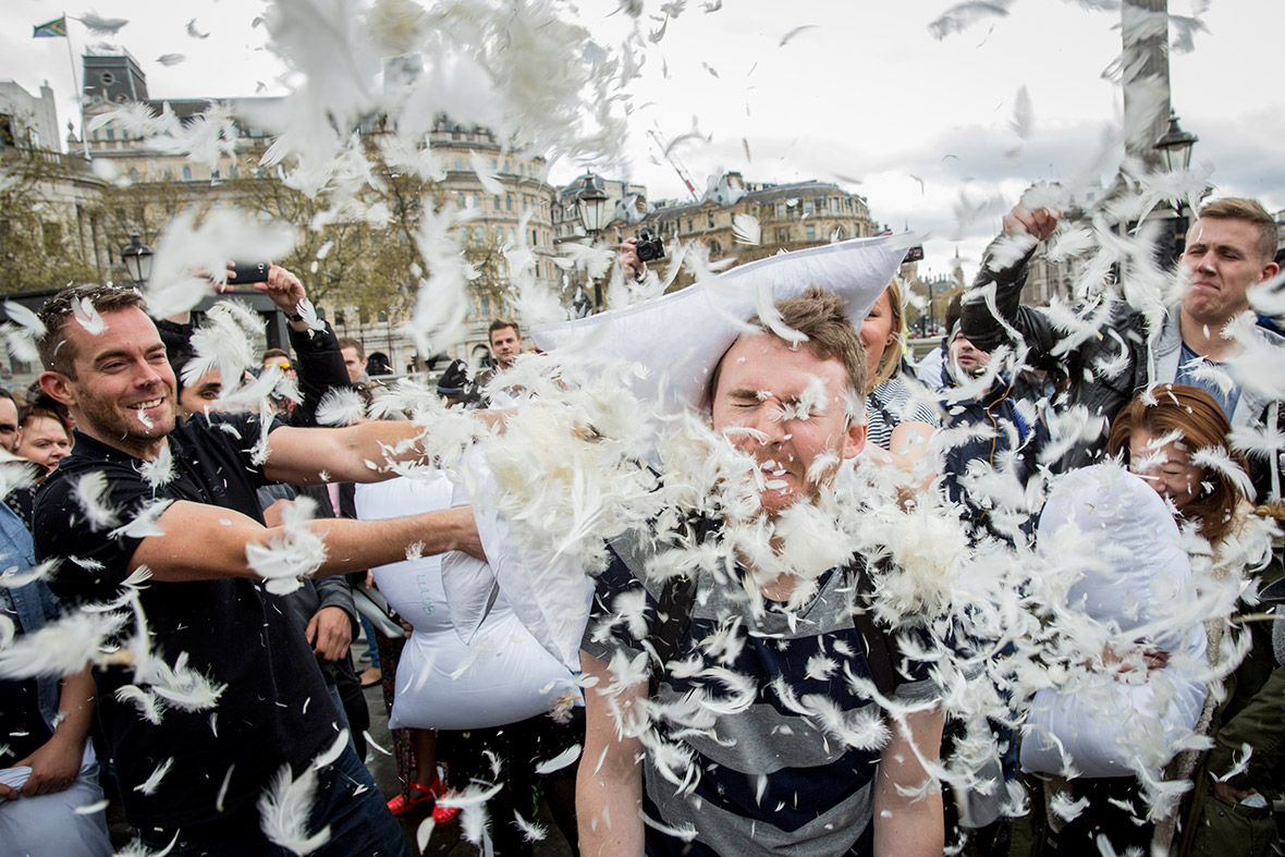 Revellers take part in a giant pillow-fight in Trafalgar Square to celebrate International Pillow Fight Day. Similar events were staged in cities around the world.