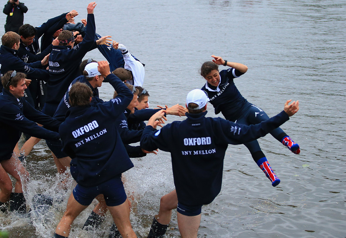 Oxford's cox Sophie Shawdon is thrown into the Thames by her crew after they won the 160th Oxford-Cambridge Boat Race