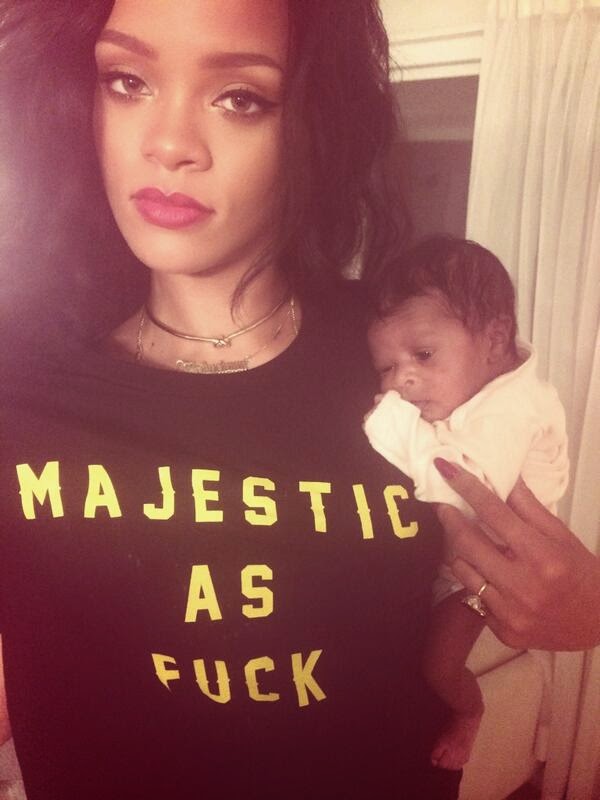 Rihanna Blasted By Fans For Wearing Inappropriate T-Shirt As She Cuddles Her Baby Cousin | Photo 1