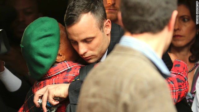 Oscar Pistorius is hugged by a woman as he leaves court in Pretoria, South Africa, on Wednesday, April 16. Pistorius, the first double amputee runner to compete in the Olympics, is accused of intentionally killing his girlfriend, Reeva Steenkamp, in February 2013. Pistorius has pleaded not guilty to murder and three weapons charges.