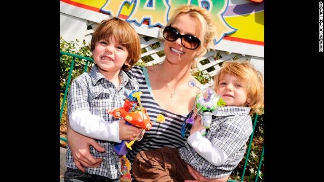 Spears poses with her sons Preston and Jayden in Mickey's Toontown Fair at the Magic Kingdom in Lake Buena Vista, Florida, in 2009. 
