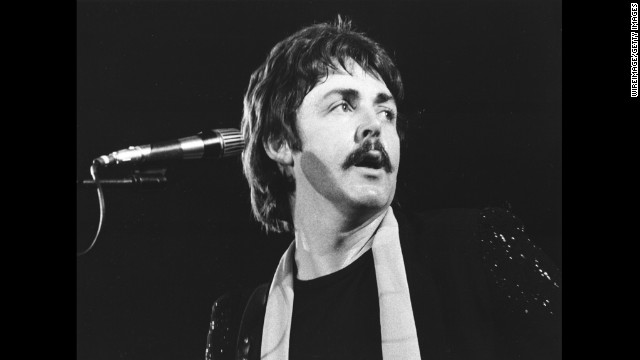 McCartney performs in 1976 with the band Wings, which he formed after The Beatles disbanded in 1970.