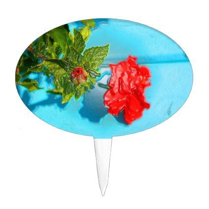 red rose against blue plastic wrap style cake toppers