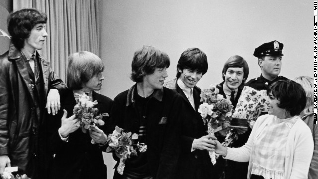 The Rolling Stones receive bouquets from fans in New York during their first U.S. tour in June 1964.