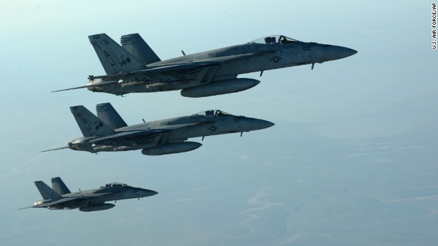 In this photo released by the U.S. Air Force, fighter jets fly over northern Iraq as part of coalition airstrikes in Syria on Tuesday, September 23. The United States and several Arab nations have started bombing ISIS targets in Syria to take out the militant group's ability to command, train and resupply its fighters.