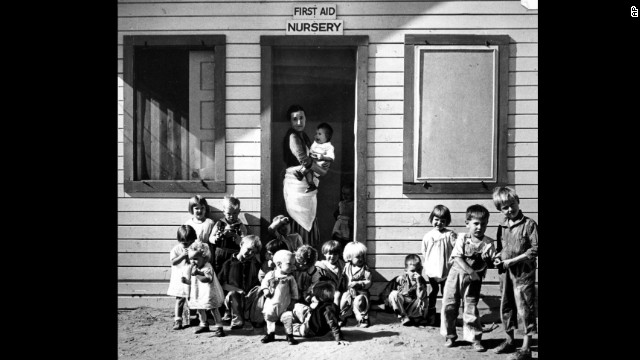A nurse took care of children of migratory farm workers in Arvin, California, in 1937. The unemployment rate hovered in the teens. 