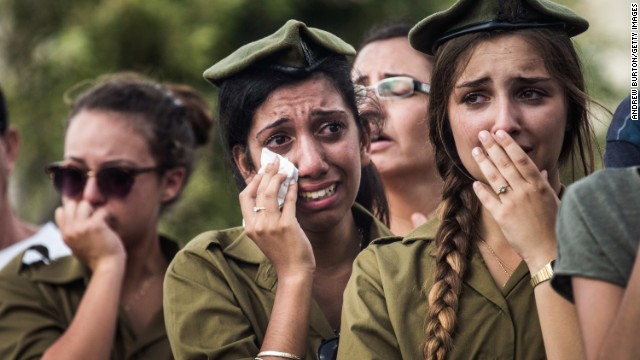 Israeli soldiers weep at the grave of Israeli Sgt. Adar Barsano during his funeral Sunday, July 20, in Nahariya, Israel.