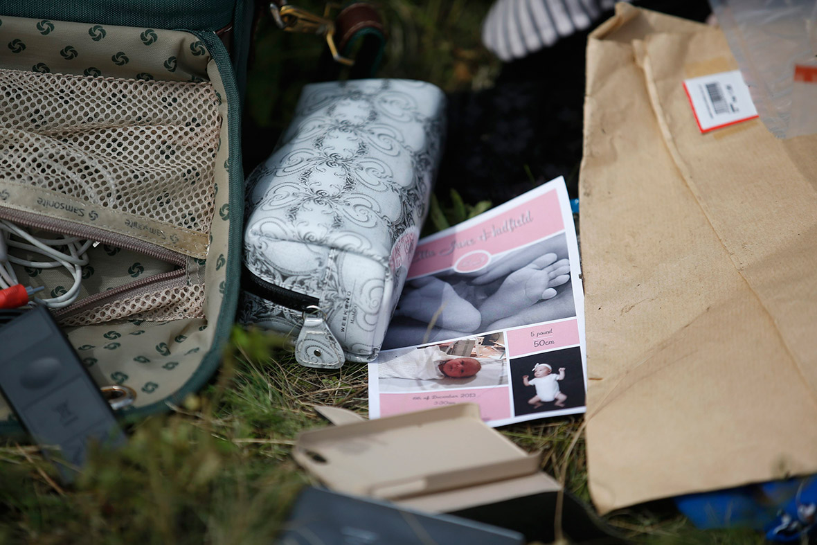 Passengers' belongings found at the crash site of Malaysia Airlines Flight MH17 are pictured near the village of Hrabove, Donetsk region, Ukraine