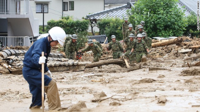 Soldiers and rescue workers look for survivors at the site.