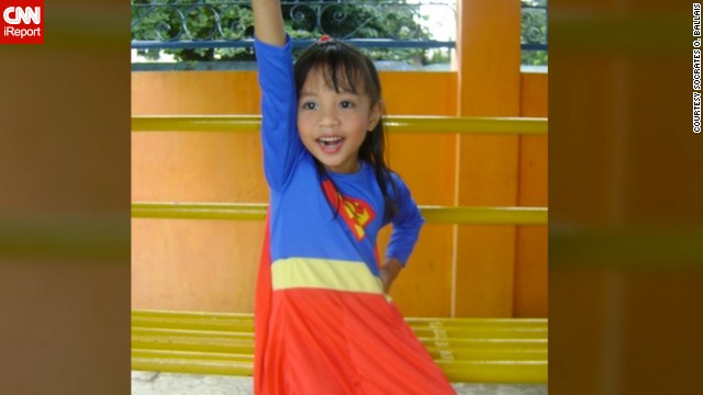 Four-year-old Anthea Ballais of Tacloban, Philippines, is <a href='http://ift.tt/1ixES9L'>seen here</a> imagining herself soaring through the air as Supergirl.