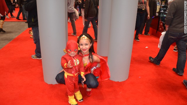 Kids can often be seen dressing like their adult cosplaying counterparts at conventions like <a href='http://ift.tt/1ixES9O'>New York Comic Con</a>. Here's Wonder Woman posing with a pint-size Flash at last year's convention in the Big Apple.