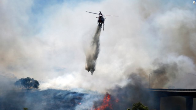 A helicopter battles the San Diego wildfire on May 13.