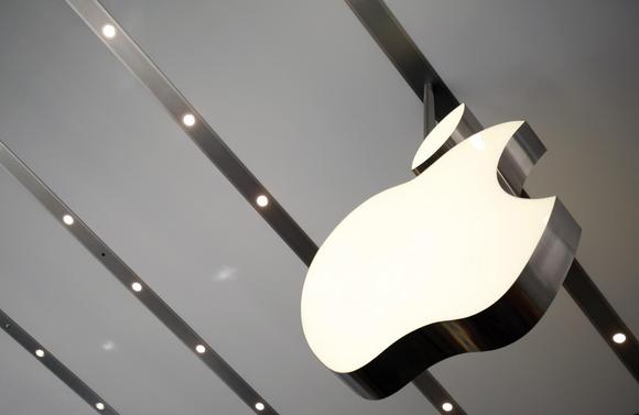 The Apple logo is pictured inside the newly opened Omotesando Apple store at a shopping district in Tokyo June 26, 2014. REUTERS/Yuya Shino