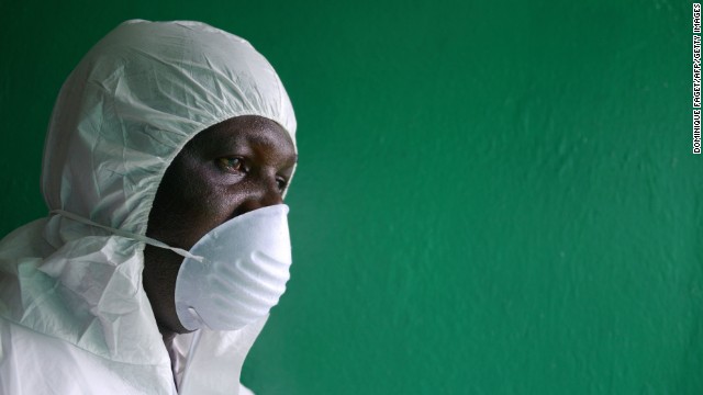 A health worker wearing a protective suit conducts an Ebola prevention drill at the port in Monrovia on Friday, August 29. 