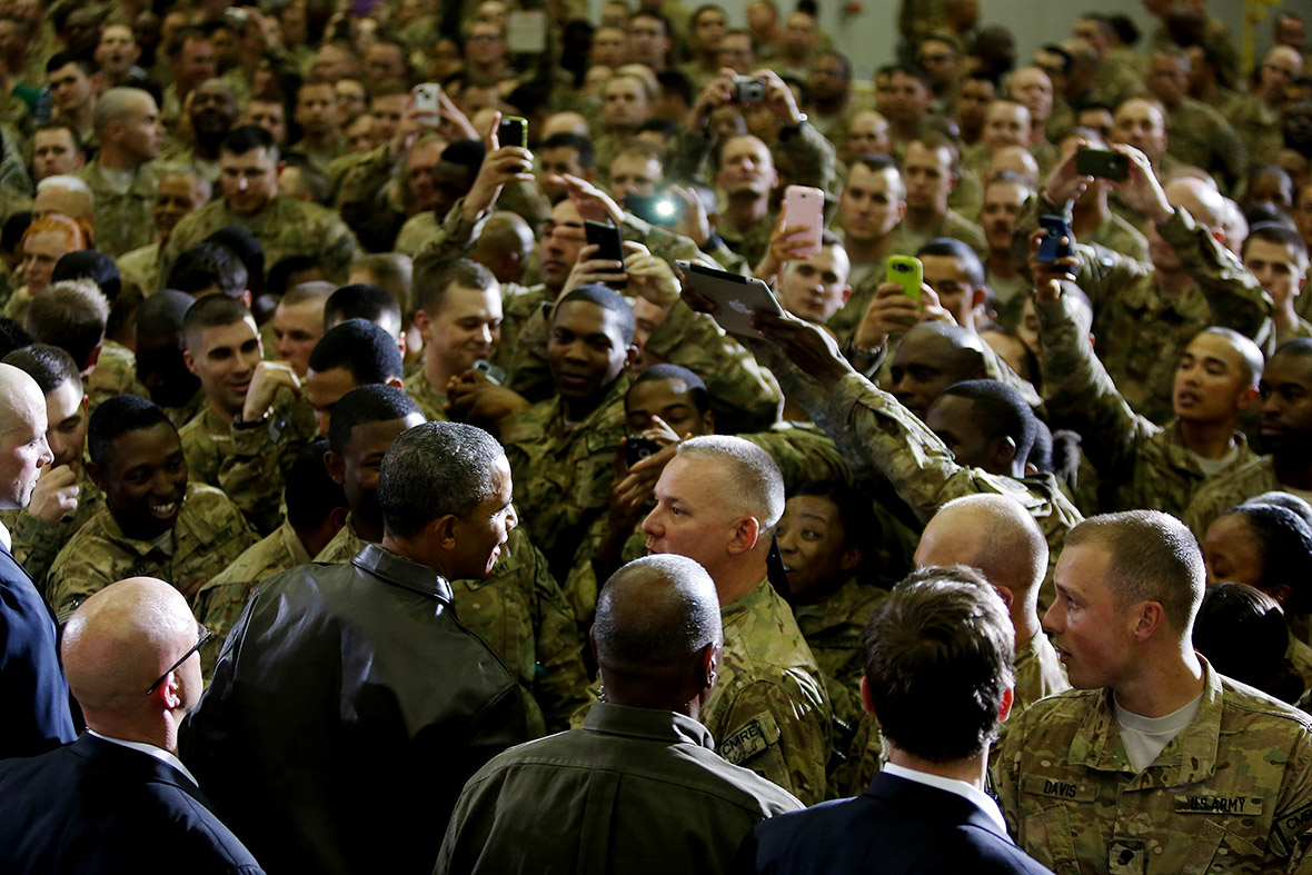 US President Barack Obama shakes hands with troops after his speech at Bagram Air Base in Kabul, Afghanistan