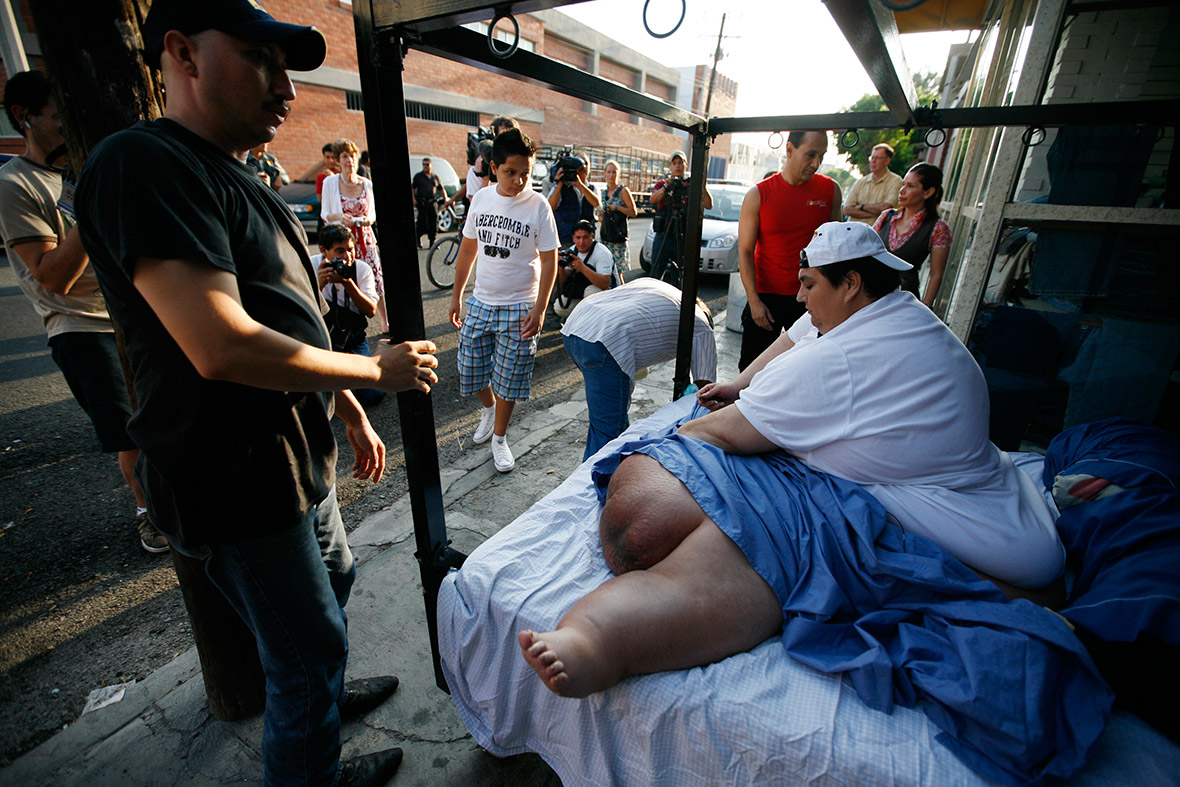 August 10, 2008: Manuel Uribe waits for a forklift as he leaves home for the first time in years
