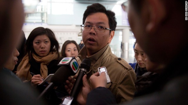 A Malaysian man who says he has relatives on board the missing plane talks to journalists at the Beijing airport on March 8.