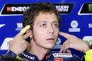 Yamaha MotoGP rider Valentino Rossi of Italy cups his ears in the box during the second free practice of the Aragon Motorcycling Grand Prix at Motorland race track in Alcaniz