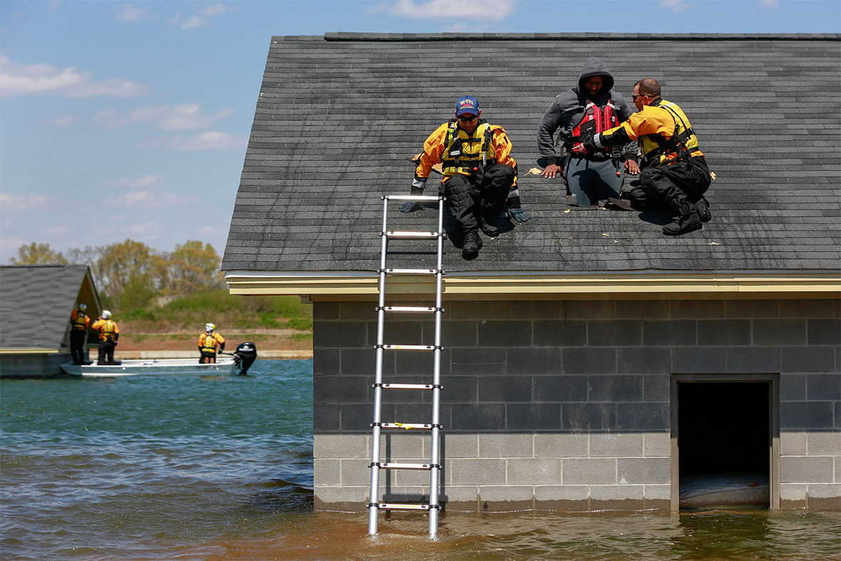 Emergency response workers rescue a 'victim' from a flooded mock disaster area during a training exercise at the Guardian Centre in Perry, Georgia