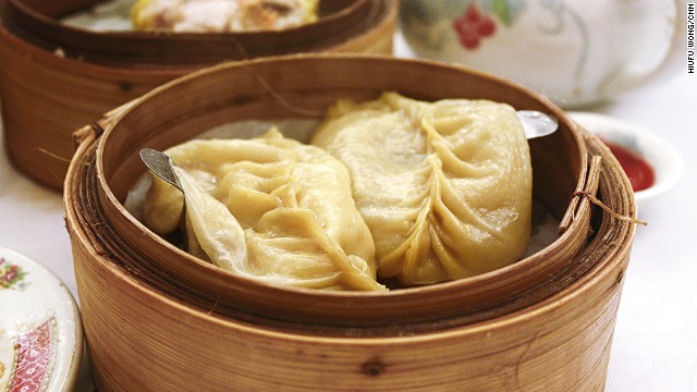 Most giant soup dumplings, or gun tong gaau in Cantonese, are now submerged in a small pot of soup. But the original gun tong gaau is actually filled with soup. To eat it, lift the dumpling to your bowl with the spoon, open a section of the wrapper and add a bit of vinegar before chowing down.