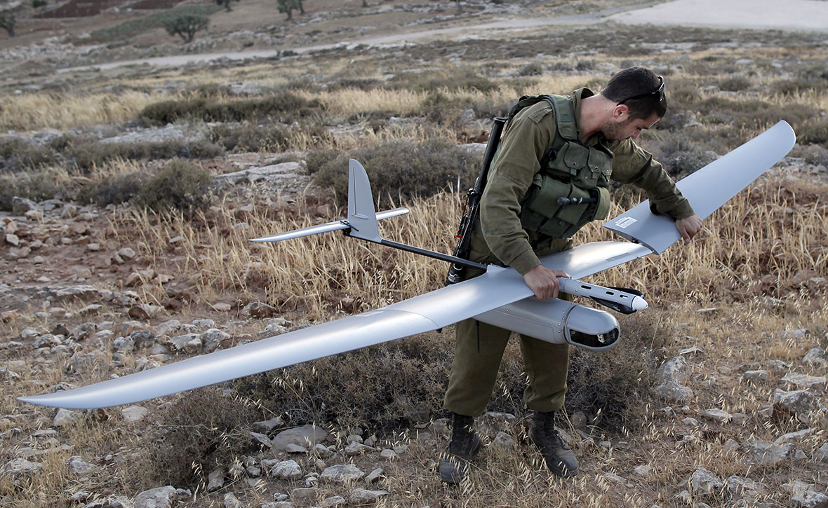 An Israeli soldier prepares a military drone for use over the West Bank town of Hebron.