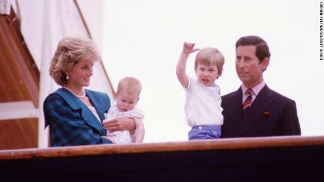 Princess Diana and Prince Charles hold Harry, left, and William on the deck of the Royal Yacht Britannia during a tour of Italy in May 1985.